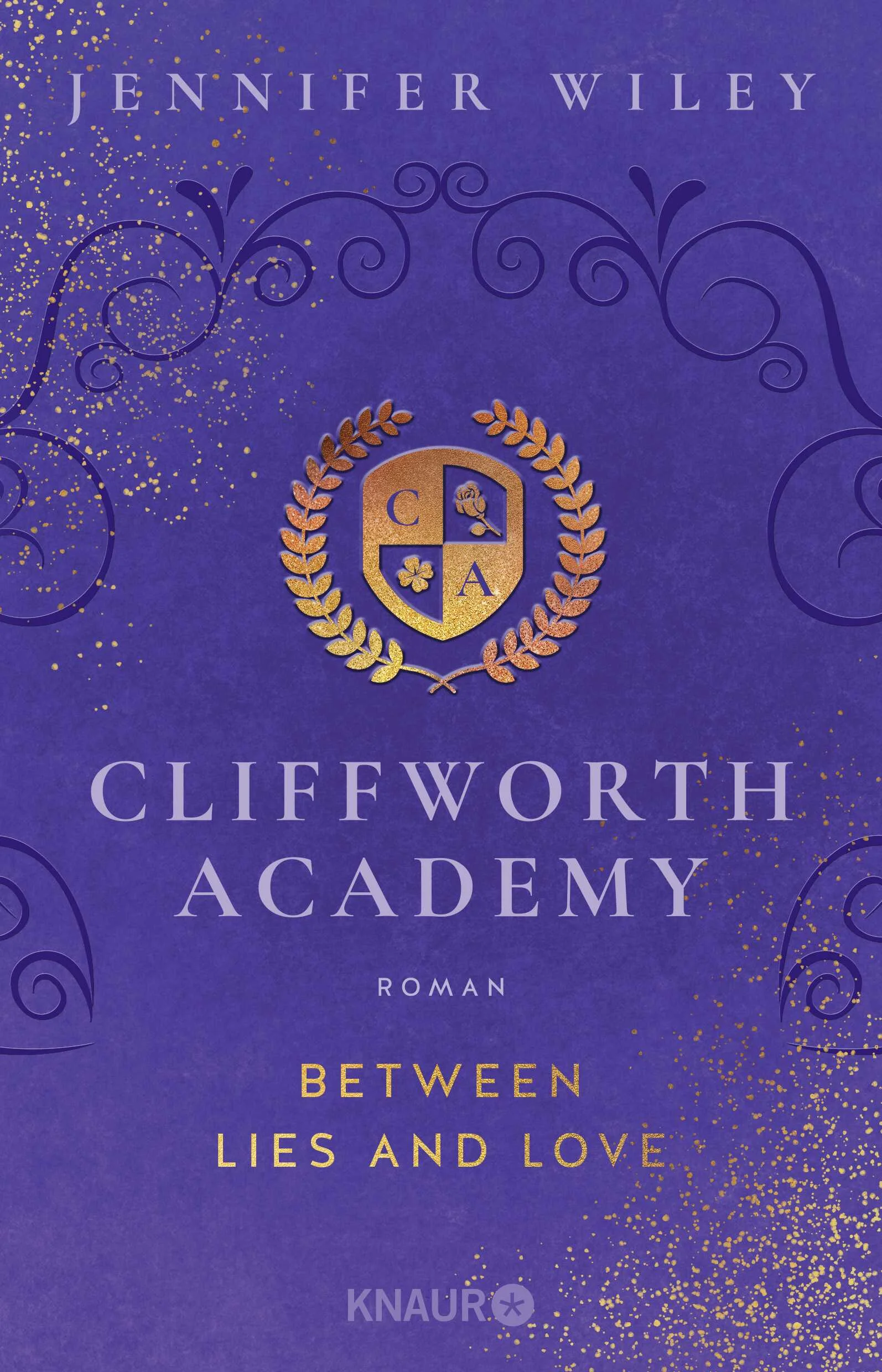 Lügen, Intrigen, Machtkämpfe – und eine Liebe gegen alle Widerstände: Willkommen an der Cliffworth Academy in Wales! »Between Lies and Love« ist der erste New-Adult-Roman von Jennifer Wileys Dark-Academia-Duett »Cliffworth Academy«.Die Chance auf ein Stipendium, das ihre Träume erfüllen könnte: 14 College-Absolvent*innen haben einen der begehrten Plätze im Sommerprogramm der Cliffworth Academy ergattert, wunderschön gelegen in einem altehrwürdigen Gebäude aus dem 16. Jahrhundert an der Küste von Wales.Unter ihnen sind auch die ehrgeizige Vada McGowen und die schüchterne Macy Moore, die sich trotz aller Unterschiede zueinander hingezogen fühlen. Doch schon am ersten Tag werden sie in zwei Gruppen eingeteilt und erfahren, dass nur eine Gruppe am Ende des Programms mit Stipendien für die renommierte Cliffworth University belohnt wird.Ein erbitterter Konkurrenzkampf entbrennt, der mit immer dunkleren Methoden geführt wird. Vada und Macy stehen sich plötzlich als Feindinnen gegenüber – und können ihre Gefühle füreinander doch nicht leugnen. Hat ihre Liebe eine Chance gegen Lügen, Intrigen und skrupellose Machtspiele?Die Dark-Academia-Romance von Jennifer Wiley begeistert mit einem atemraubenden Setting und einer queeren Liebe, die sich gegen Geheimnisse und düstere Machenschaften behaupten muss.Lust auf mehr? Entdecke auch die zweite Romance des Duetts: »Cliffworth Academy – Between Shadows and Light«.